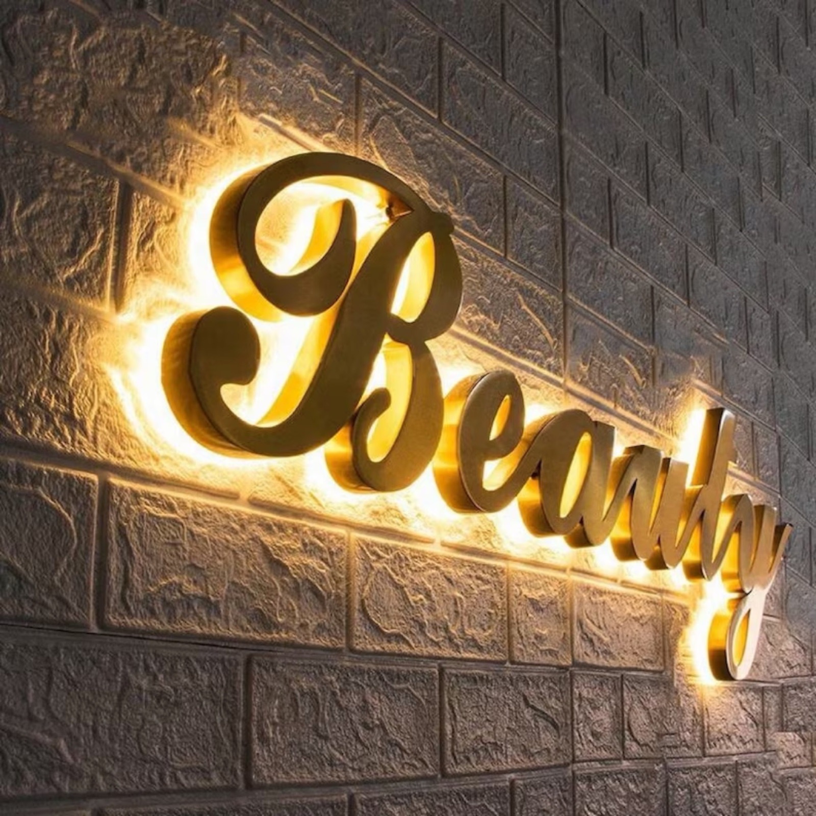 Halo-lit letters glowing from behind on a dark wall